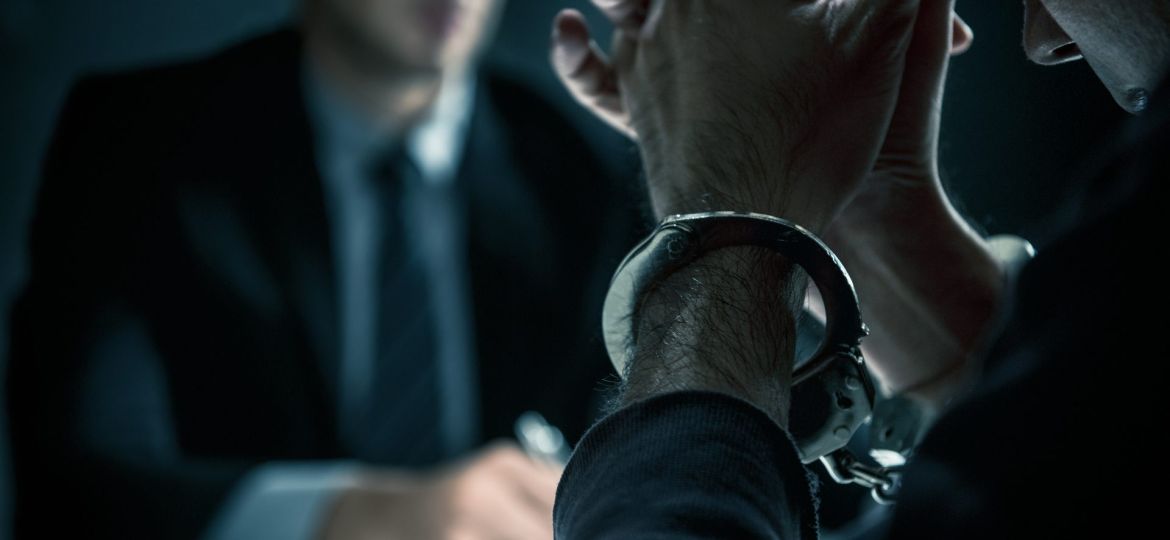 bigstock-Criminal-Man-With-Handcuffs-In-308290204 (Demo)